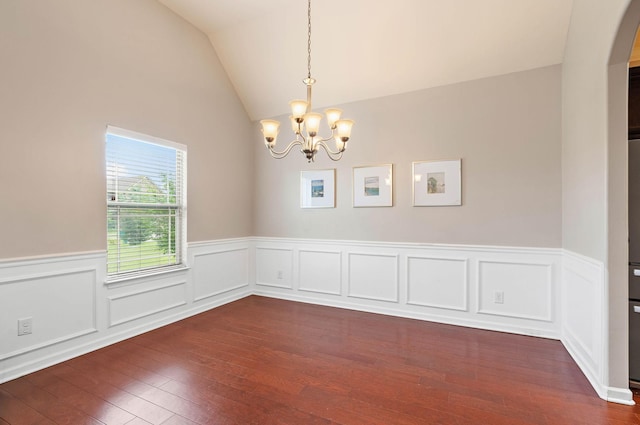 2034 Lincoln Rd, Spring Hill, TN 37174 - spare room featuring a chandelier, dark wood-style flooring, a wainscoted wall, arched walkways, and vaulted ceiling