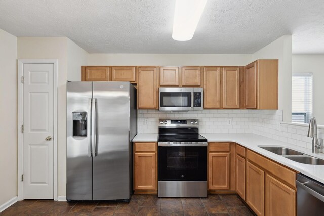 4641 Cather Ct, Nashville, TN 37214 - kitchen featuring stainless steel appliances, a sink, light countertops, tasteful backsplash, and a textured ceiling