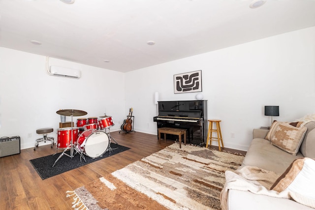 2101 Dearborn Dr, Nashville, TN 37214 - living area featuring wood finished floors, a wall mounted air conditioner, and baseboards
