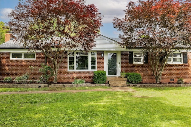 2101 Dearborn Dr, Nashville, TN 37214 - view of front facade featuring brick siding, a front yard, a chimney, and crawl space