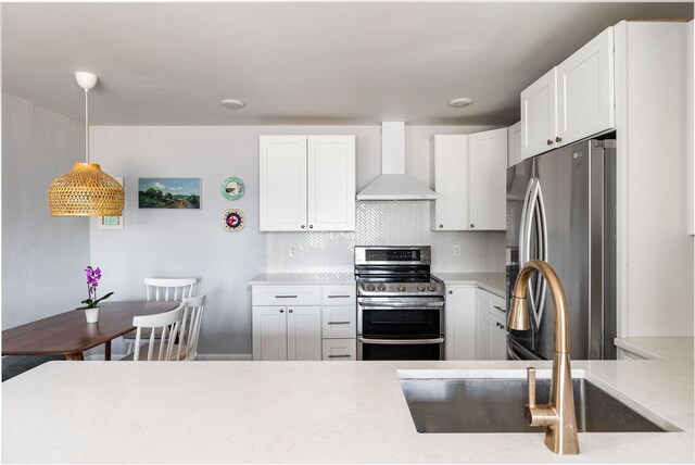 2101 Dearborn Dr, Nashville, TN 37214 - kitchen featuring wall chimney exhaust hood, stainless steel appliances, a sink, and light countertops
