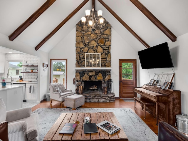 2521 Greens Mill Rd, Columbia, TN 38401 - living room with a fireplace, beam ceiling, a chandelier, high vaulted ceiling, and light wood-type flooring