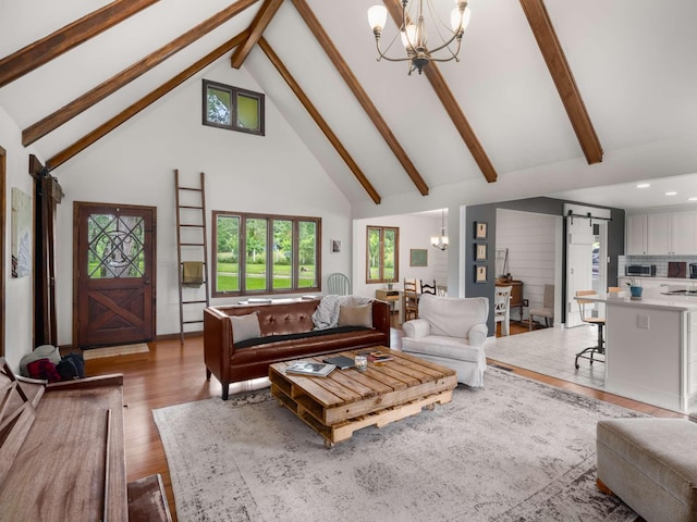 2521 Greens Mill Rd, Columbia, TN 38401 - living area featuring a chandelier, a barn door, high vaulted ceiling, light wood finished floors, and beamed ceiling