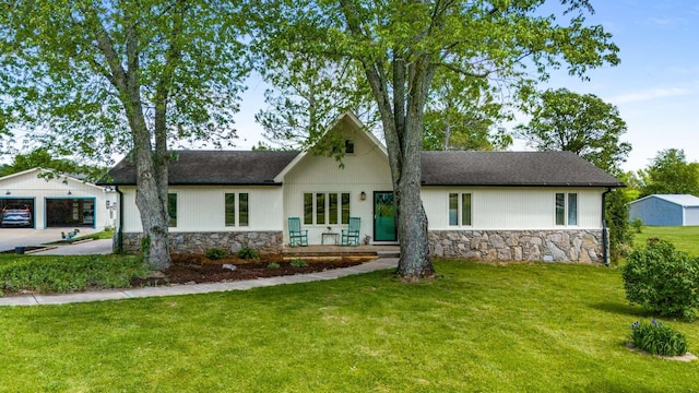 2521 Greens Mill Rd, Columbia, TN 38401 - view of front of property with stone siding, a front yard, and roof with shingles