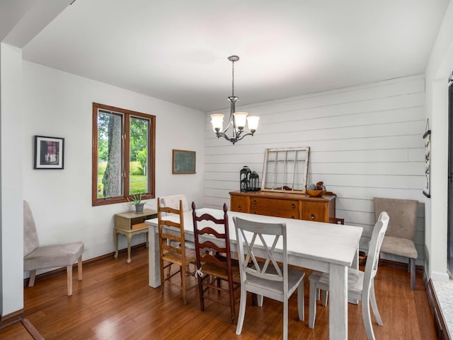2521 Greens Mill Rd, Columbia, TN 38401 - dining area featuring a chandelier, wood finished floors, baseboards, and wooden walls