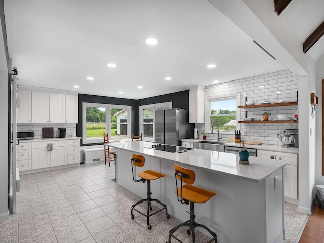 2521 Greens Mill Rd, Columbia, TN 38401 - kitchen featuring appliances with stainless steel finishes, a sink, decorative backsplash, recessed lighting, and white cabinetry