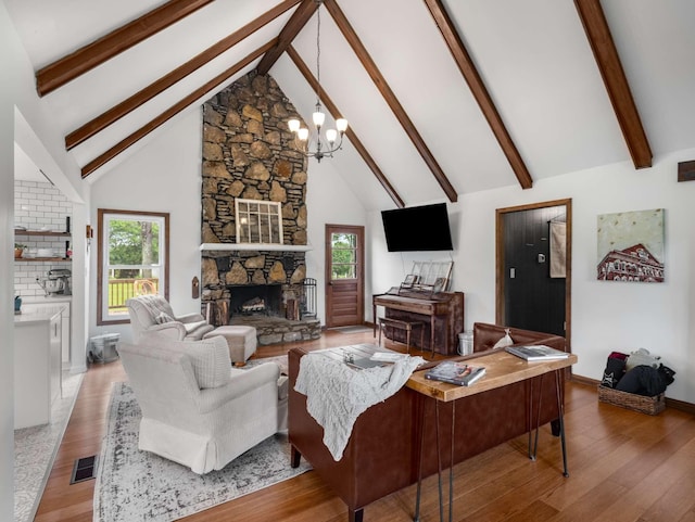 2521 Greens Mill Rd, Columbia, TN 38401 - living room featuring a fireplace, a chandelier, beamed ceiling, high vaulted ceiling, and wood finished floors