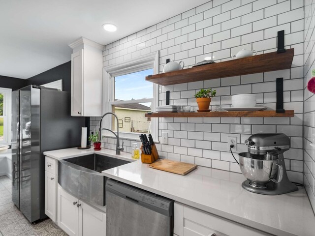 2521 Greens Mill Rd, Columbia, TN 38401 - kitchen with appliances with stainless steel finishes, a sink, decorative backsplash, and light countertops