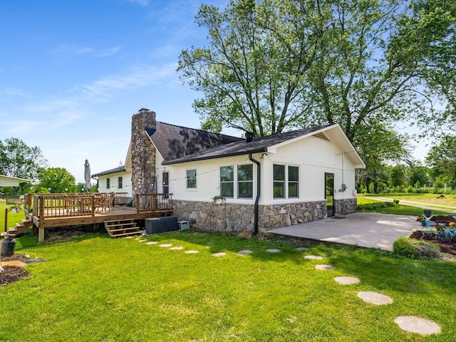 2521 Greens Mill Rd, Columbia, TN 38401 - back of property with stone siding, a wooden deck, a patio, and a chimney