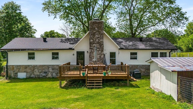 2521 Greens Mill Rd, Columbia, TN 38401 - back of property featuring a chimney, stone siding, a yard, a wooden deck, and roof with shingles