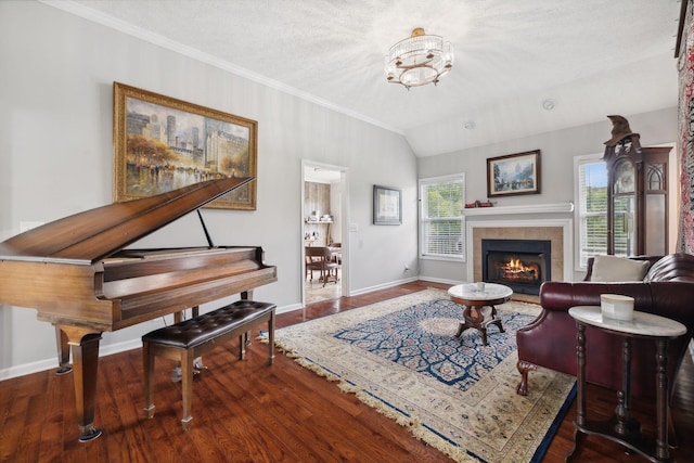 1179 Viewmont Dr, Clarksville, TN 37040 - living room with baseboards, wood finished floors, a tile fireplace, crown molding, and vaulted ceiling
