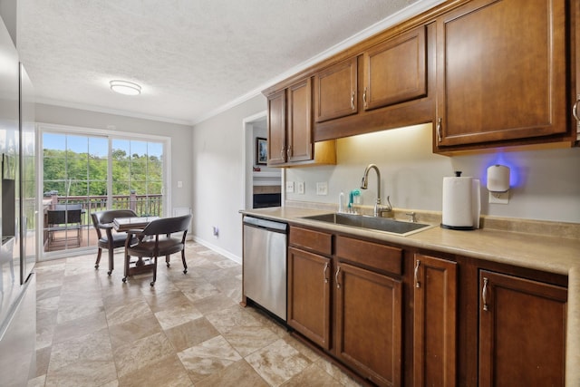 1179 Viewmont Dr, Clarksville, TN 37040 - kitchen with stainless steel appliances, a sink, crown molding, light countertops, and brown cabinetry