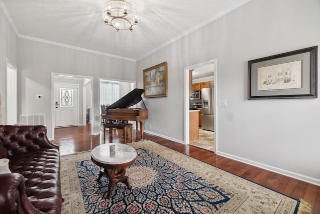 1179 Viewmont Dr, Clarksville, TN 37040 - living area with wood finished floors, ornamental molding, a chandelier, and baseboards