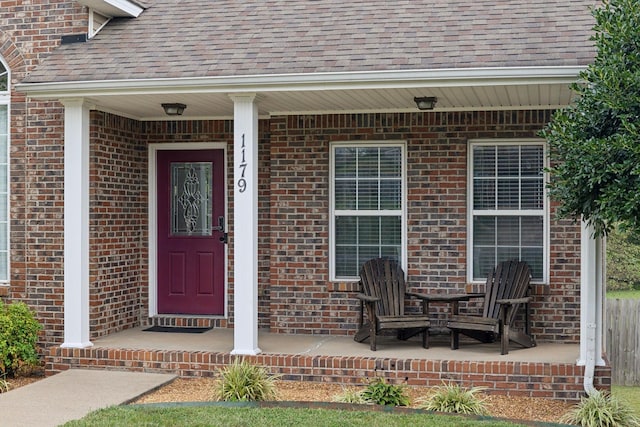 1179 Viewmont Dr, Clarksville, TN 37040 - entrance to property with roof with shingles, brick siding, and covered porch