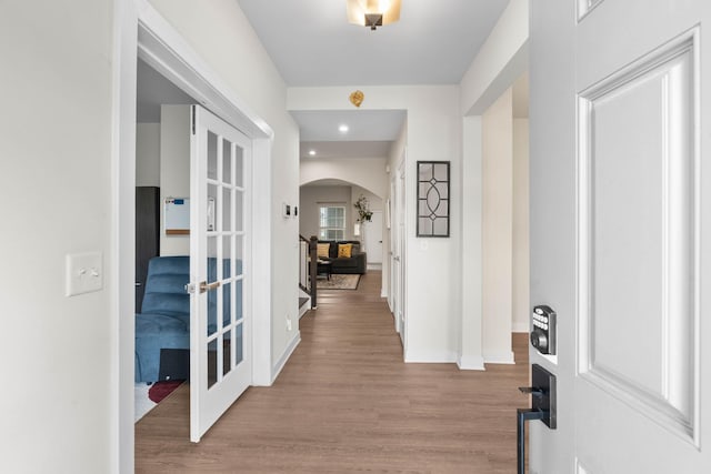 8061 Warbler Way, Brentwood, TN 37027 - foyer entrance with arched walkways, wood finished floors, baseboards, french doors, and recessed lighting