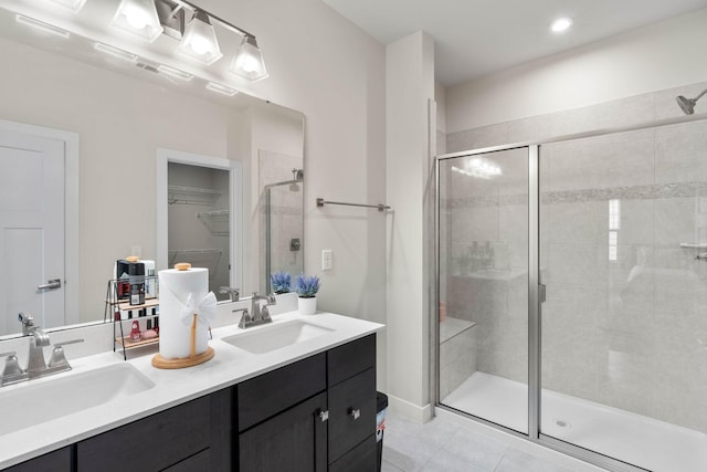 8061 Warbler Way, Brentwood, TN 37027 - full bath featuring a stall shower, double vanity, tile patterned floors, a spacious closet, and recessed lighting