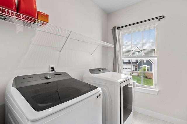 8061 Warbler Way, Brentwood, TN 37027 - washroom with washing machine and dryer, baseboards, and light tile patterned flooring