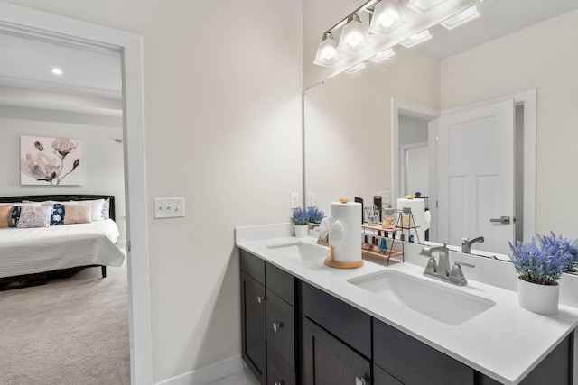 8061 Warbler Way, Brentwood, TN 37027 - ensuite bathroom with double vanity, recessed lighting, and baseboards