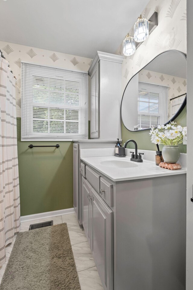 301 Tyler Dr, Hermitage, TN 37076 - full bathroom with vanity, wallpapered walls, and a shower with curtain