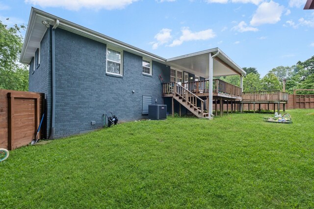 301 Tyler Dr, Hermitage, TN 37076 - rear view of house featuring a wooden deck, stairs, brick siding, and central AC
