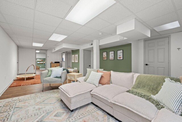 301 Tyler Dr, Hermitage, TN 37076 - living room featuring wood finished floors, a drop ceiling, and baseboards