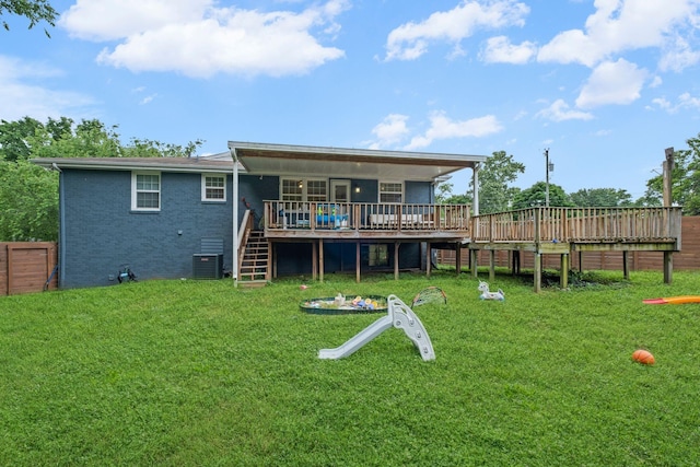 301 Tyler Dr, Hermitage, TN 37076 - back of property with stairway, a deck, central AC unit, and brick siding