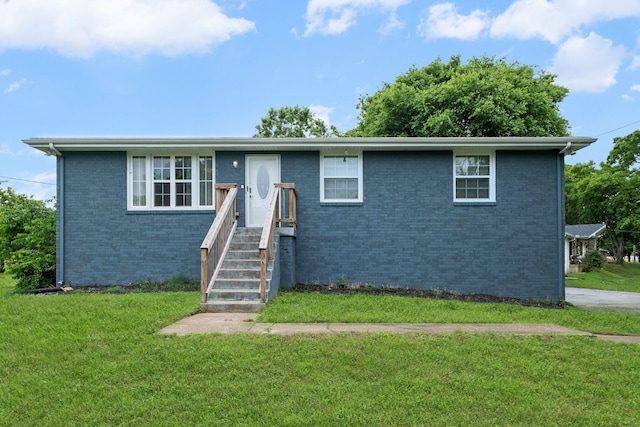 301 Tyler Dr, Hermitage, TN 37076 - view of front facade with a front lawn and brick siding