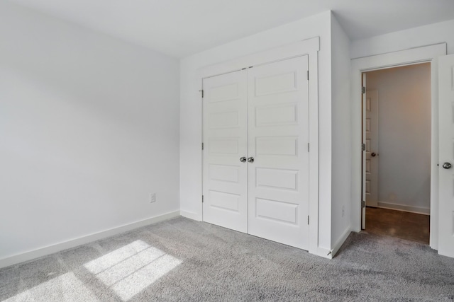 836 Ewell Farm Dr, Spring Hill, TN 37174 - unfurnished bedroom with carpet floors, a closet, and baseboards