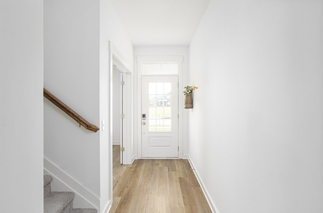 836 Ewell Farm Dr, Spring Hill, TN 37174 - doorway with light wood-style flooring, baseboards, and stairs