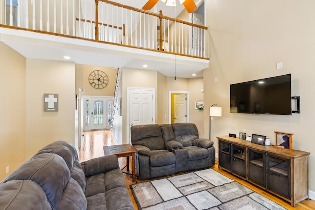 2931 Runnymeade Dr, Murfreesboro, TN 37127 - living room with a towering ceiling, wood finished floors, and a ceiling fan