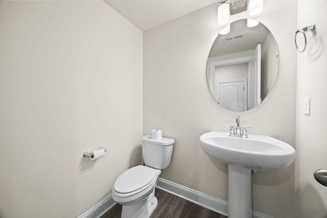 700 Taylor Bend Rd, Columbia, TN 38401 - half bath with baseboards, wood finished floors, and toilet