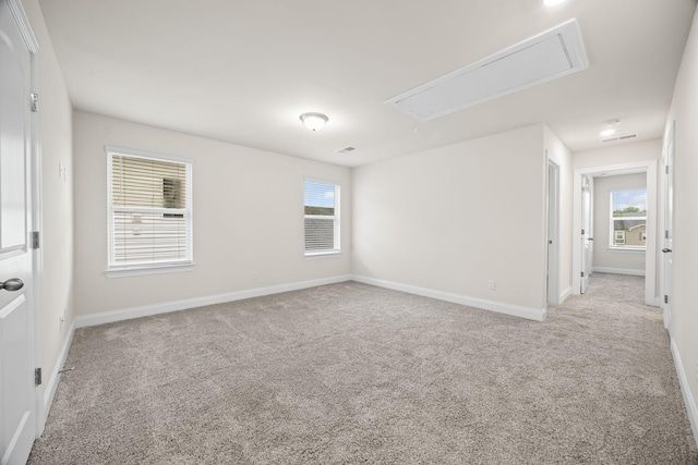 700 Taylor Bend Rd, Columbia, TN 38401 - spare room featuring attic access, light colored carpet, baseboards, and plenty of natural light