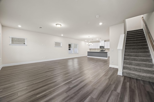 700 Taylor Bend Rd, Columbia, TN 38401 - unfurnished living room featuring stairs, dark wood-style floors, a chandelier, recessed lighting, and baseboards