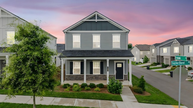 700 Taylor Bend Rd, Columbia, TN 38401 - view of front facade with covered porch, board and batten siding, and stone siding