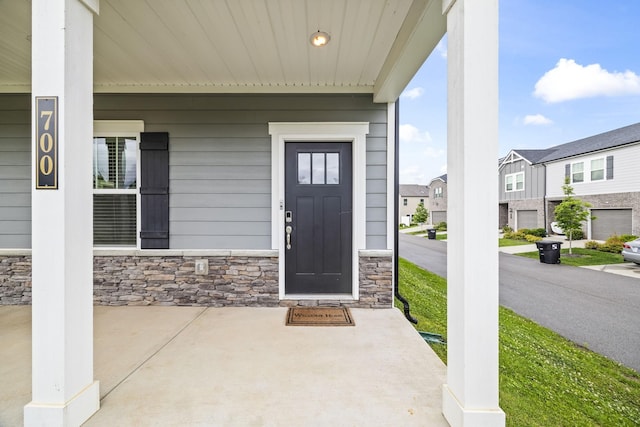 700 Taylor Bend Rd, Columbia, TN 38401 - view of exterior entry with a porch, stone siding, and a residential view