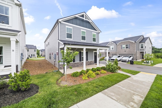 700 Taylor Bend Rd, Columbia, TN 38401 - view of front of house featuring a porch, board and batten siding, a front yard, and a residential view