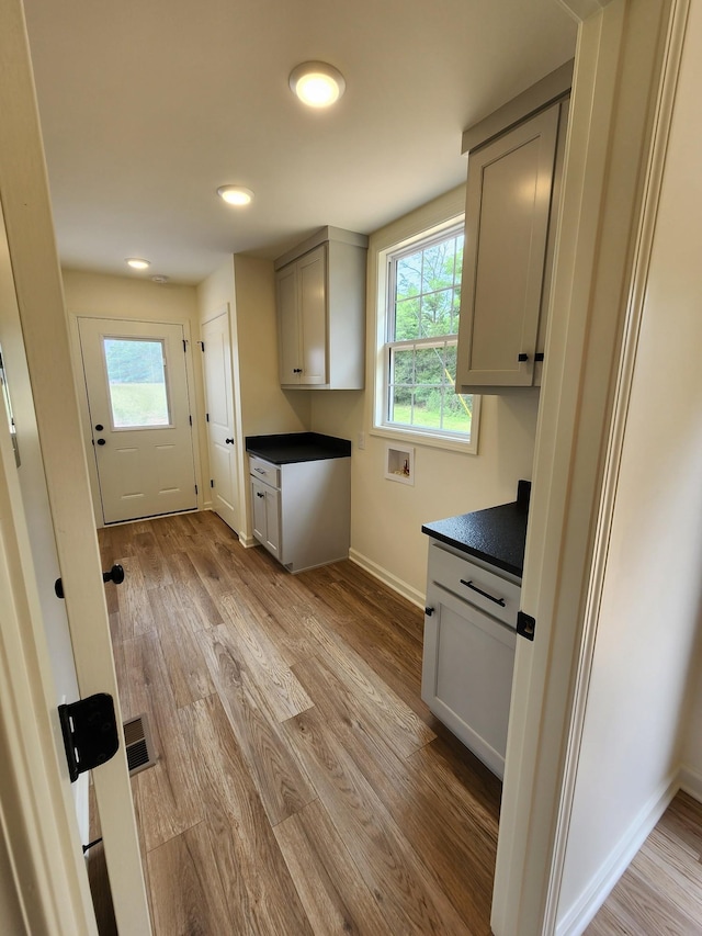 524 Pleasant Hill Rd, Lafayette, TN 37083 - kitchen featuring dark countertops, plenty of natural light, baseboards, wood finished floors, and recessed lighting
