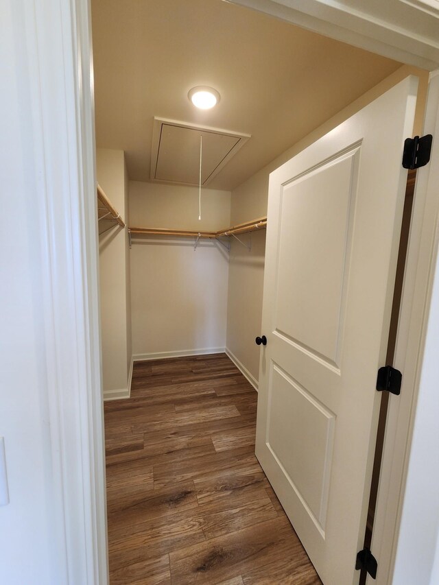 524 Pleasant Hill Rd, Lafayette, TN 37083 - walk in closet with attic access and wood finished floors