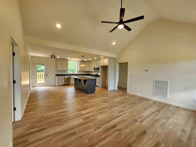 524 Pleasant Hill Rd, Lafayette, TN 37083 - unfurnished living room featuring ceiling fan, high vaulted ceiling, light wood-style floors, recessed lighting, and baseboards