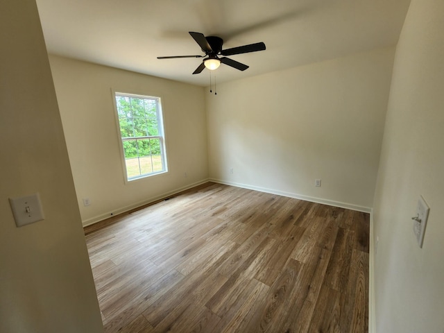 524 Pleasant Hill Rd, Lafayette, TN 37083 - unfurnished room with wood finished floors, a ceiling fan, and baseboards