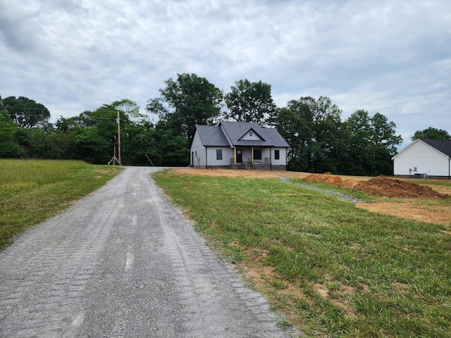 524 Pleasant Hill Rd, Lafayette, TN 37083 - view of front of house featuring dirt driveway and a front lawn