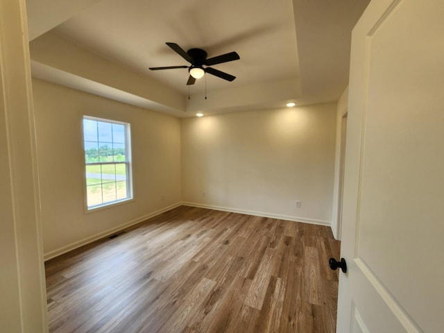 524 Pleasant Hill Rd, Lafayette, TN 37083 - unfurnished room featuring a raised ceiling, wood finished floors, a ceiling fan, baseboards, and recessed lighting