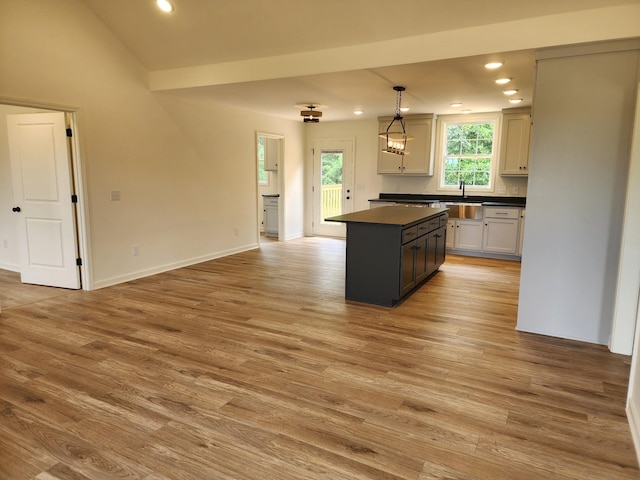 524 Pleasant Hill Rd, Lafayette, TN 37083 - kitchen with dark countertops, recessed lighting, a sink, a kitchen island, and light wood finished floors