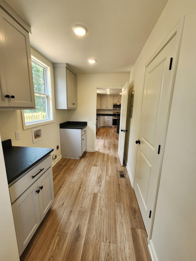 524 Pleasant Hill Rd, Lafayette, TN 37083 - laundry area featuring cabinet space, washer hookup, light wood-type flooring, baseboards, and recessed lighting