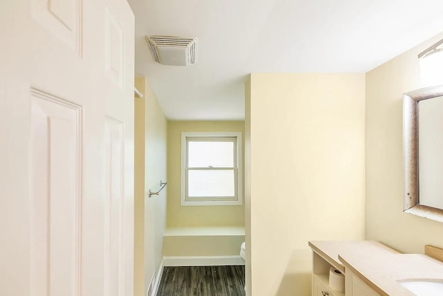 2401 Vaulx Ln, Nashville, TN 37204 - bathroom with vanity, wood finished floors, toilet, and baseboards