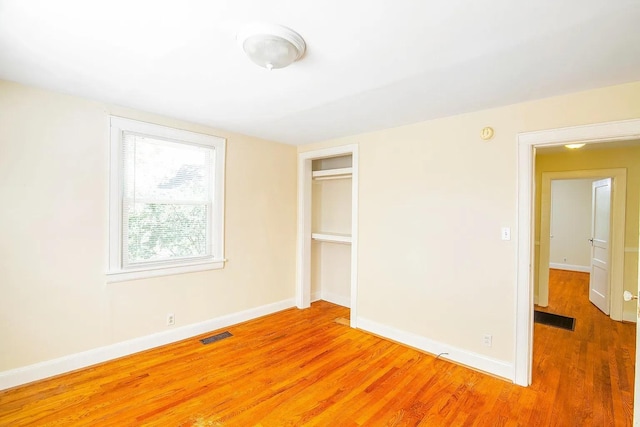 2401 Vaulx Ln, Nashville, TN 37204 - unfurnished bedroom featuring light wood-style floors, baseboards, and a closet