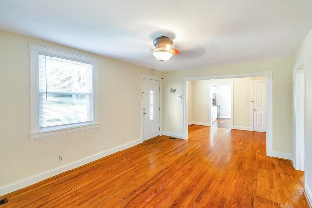2401 Vaulx Ln, Nashville, TN 37204 - empty room with light wood-type flooring, a ceiling fan, and baseboards