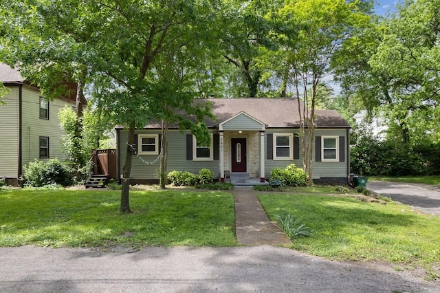 2401 Vaulx Ln, Nashville, TN 37204 - view of front facade featuring a front yard and roof with shingles