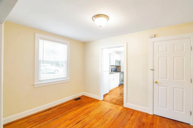 2401 Vaulx Ln, Nashville, TN 37204 - unfurnished room featuring light wood-type flooring and baseboards