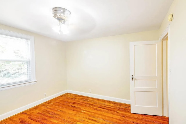 2401 Vaulx Ln, Nashville, TN 37204 - empty room featuring baseboards, light wood-style floors, and a smoke detector